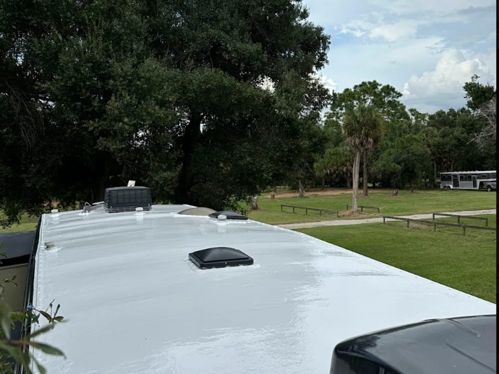 The coated roof of the Cardinal fifth wheel, white high-solids silicone